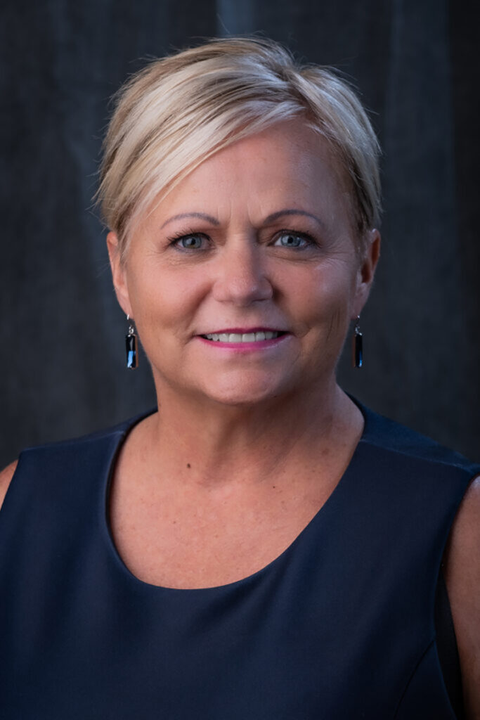 Erin D. Batey, president of the board for an Oklahoma City adult learning center, smiles in a professional headshot.